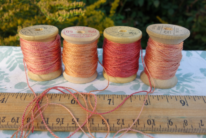 rally dyed shades of light pink, orange and rose silk embroidery thread