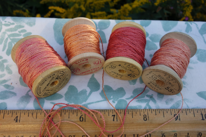 rally dyed shades of light pink, orange and rose silk embroidery thread