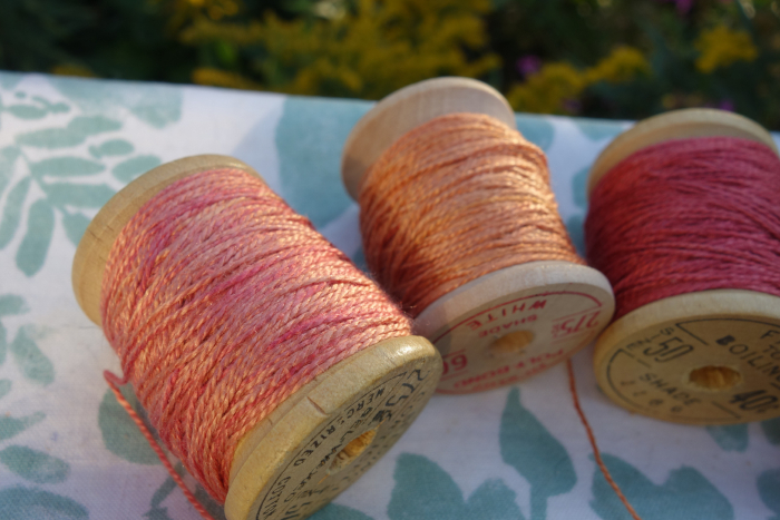 rally dyed shades of light pink, orange and rose silk embroidery thread