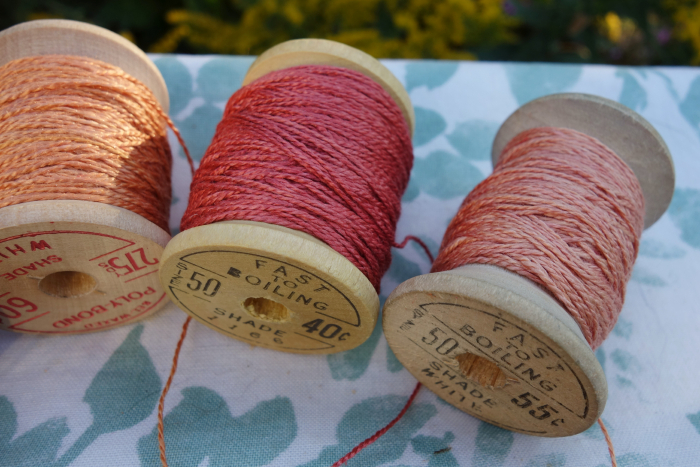rally dyed shades of light pink, orange and rose silk embroidery thread