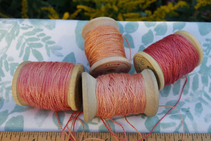 rally dyed shades of light pink, orange and rose silk embroidery thread