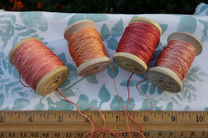 rally dyed shades of light pink, orange and rose silk embroidery thread