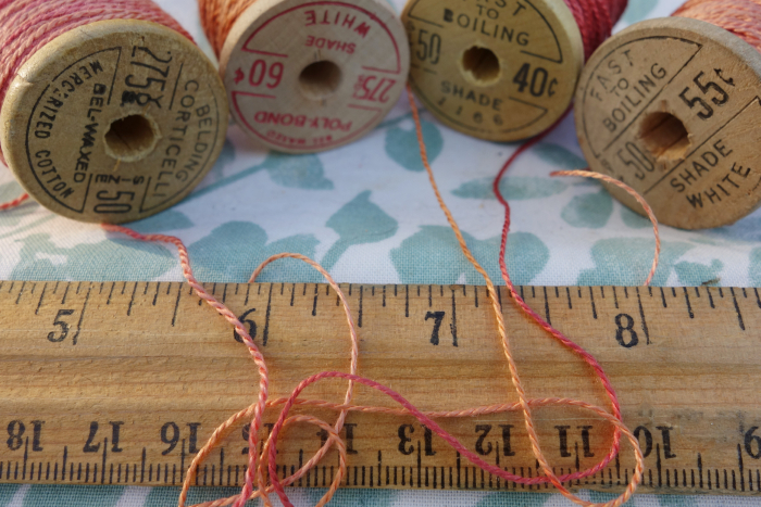 rally dyed shades of light pink, orange and rose silk embroidery thread
