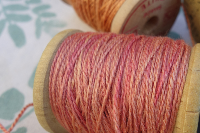 rally dyed shades of light pink, orange and rose silk embroidery thread