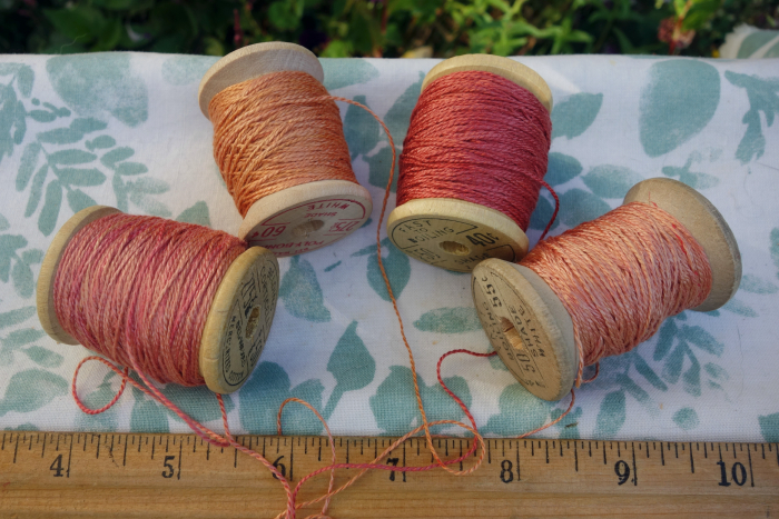 rally dyed shades of light pink, orange and rose silk embroidery thread