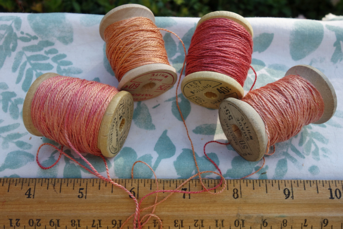 rally dyed shades of light pink, orange and rose silk embroidery thread