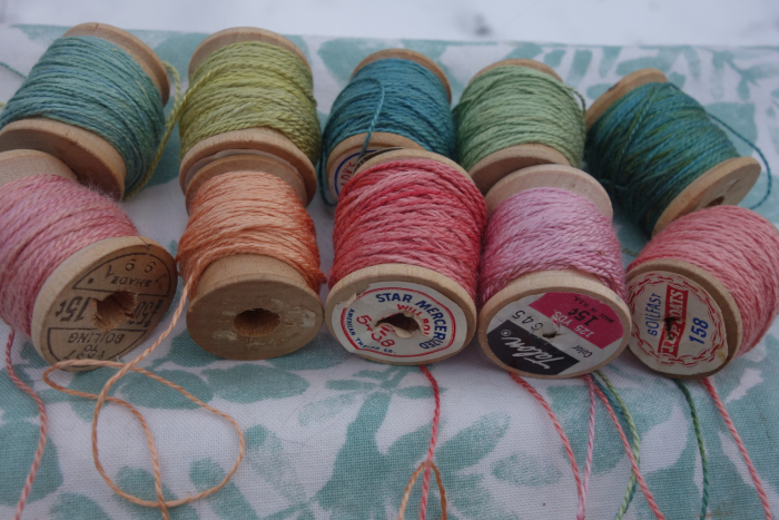 naturally dyed shades of green and pink silk thread