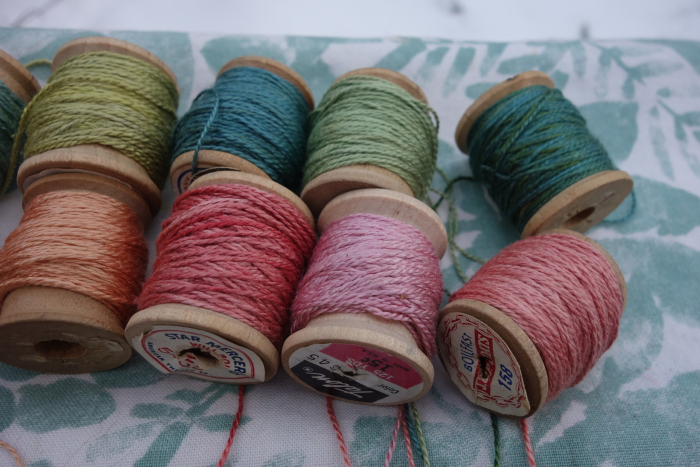 naturally dyed shades of green and pink silk thread