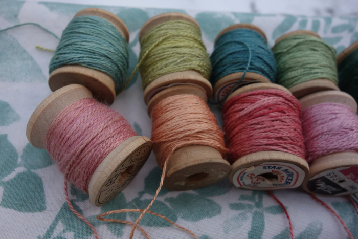 naturally dyed shades of green and pink silk thread