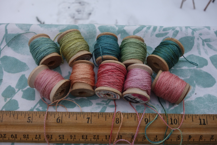 naturally dyed shades of green and pink silk thread