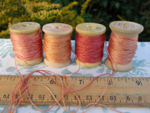 rally dyed shades of light pink, orange and rose silk embroidery thread