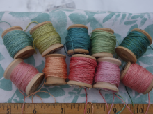 naturally dyed shades of green and pink silk thread